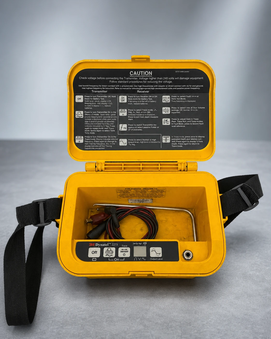3M Dynatel 2273 transmitter case and test leads on a studio background